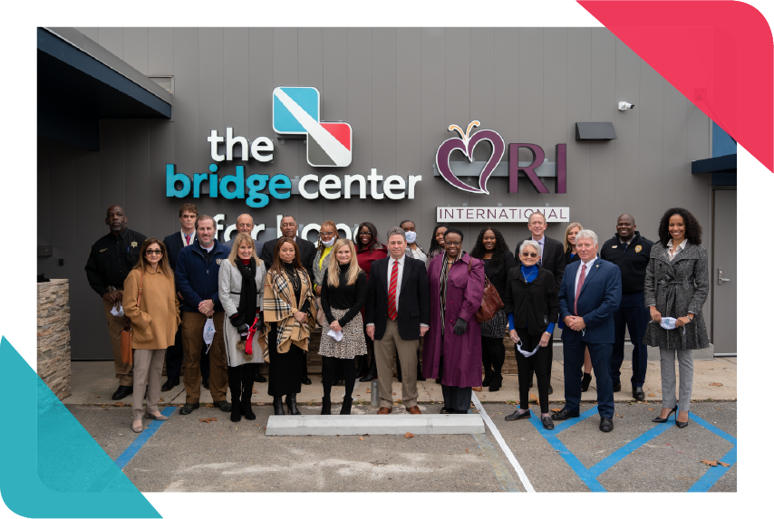Grand opening image, people standing in front of Bridge Center building
